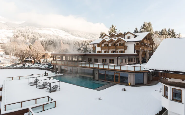 Absolutely stunning impressions Hotel with heated outdoor pool and snowy winter mountain landscape